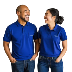 Two Virtual Assistants from the Philippines smiling and wearing branded Virtual Coworker polo shirts
